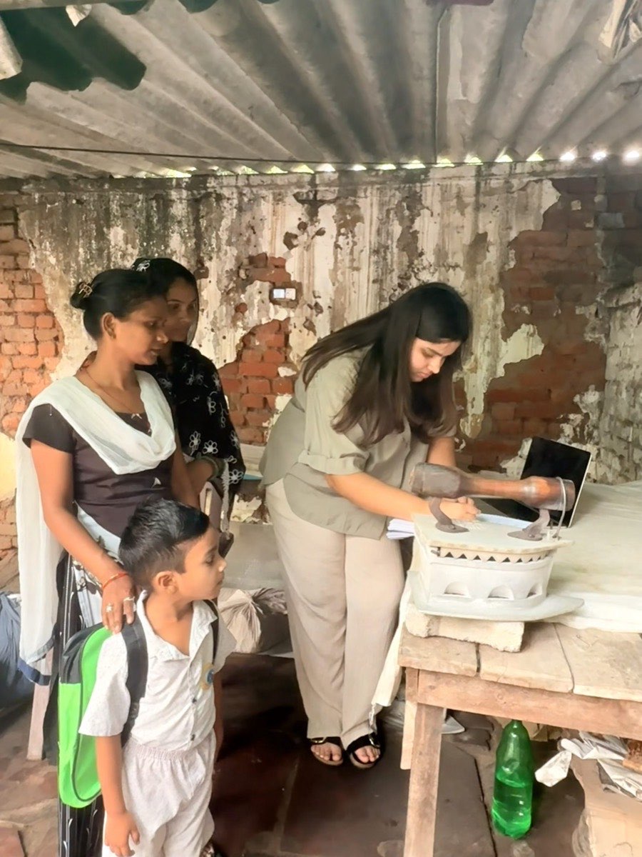 RISE team member showing digital tools to women founders and their families